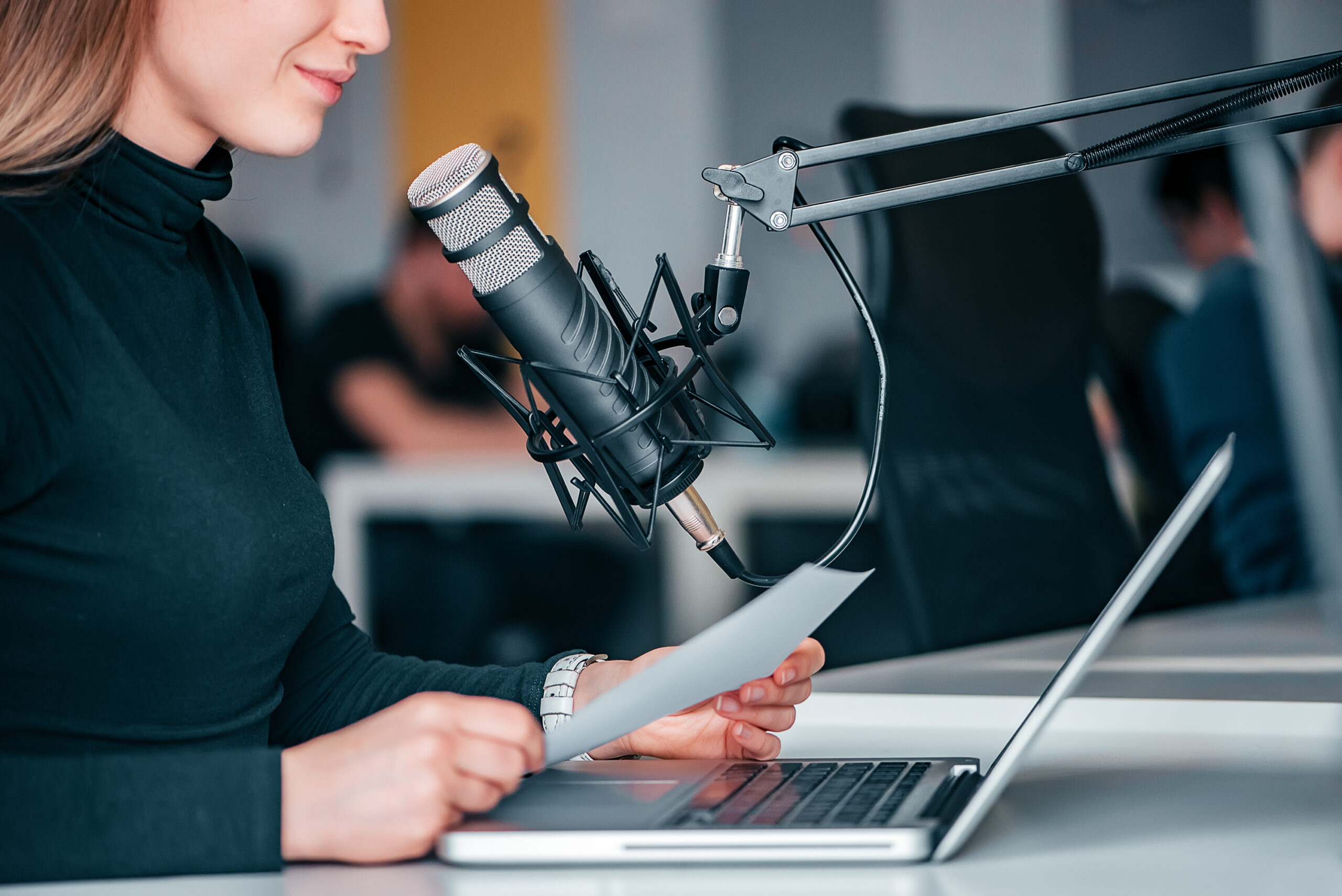 Young,Woman,Recording,A,Podcast,In,A,Studio,,Close-up.